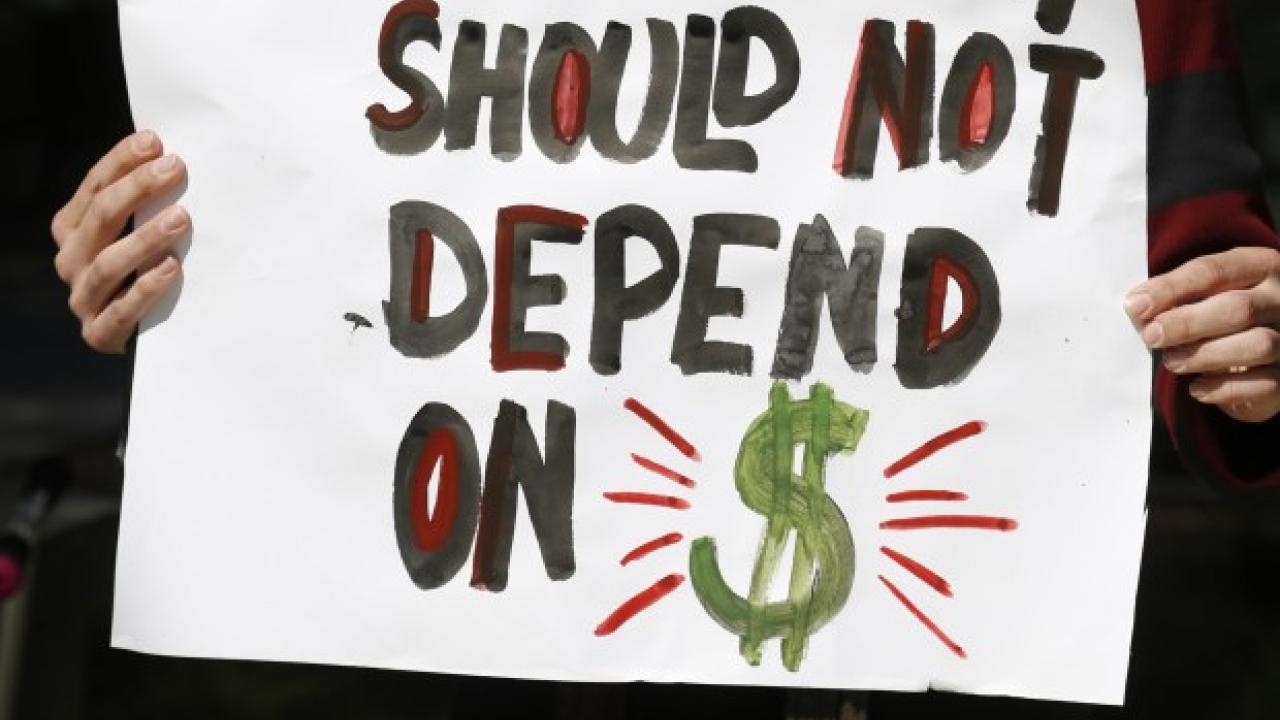 File photo of a San Jose State University student rallying last year against CSU tuition hikes. Patrick Tehan/Bay Area News Group Mercury News